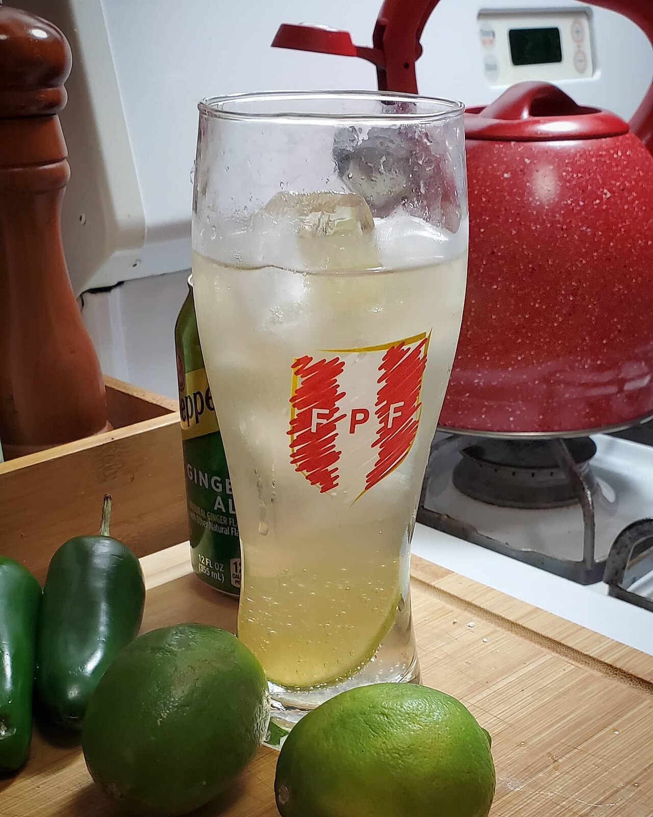 A tall Chilcano de pisco cocktail with lime