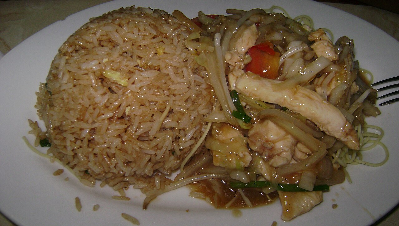 A chifa combination plate of fried rice and stir-fried noodles